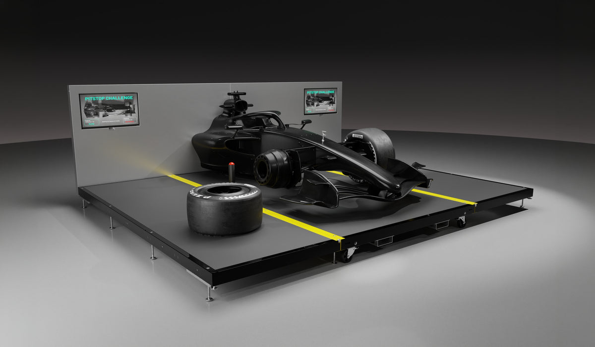 Carbon fibre pit stop rig, front three-quarter view with a wheel off