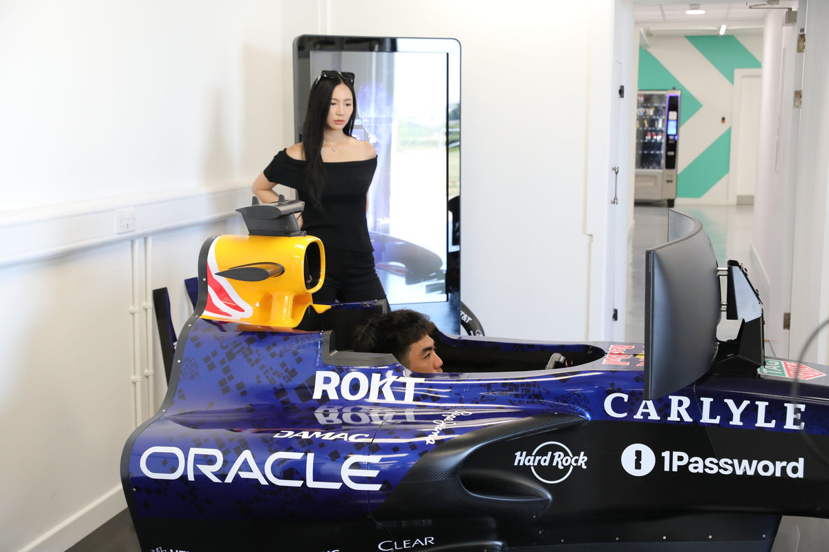 Guest driving a Red Bull Racing simulator